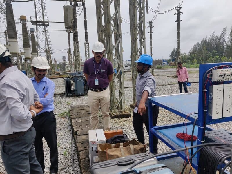SDES field engineers performing calibration at a grid substation